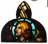 ELYGM:1982.16.19Trefoil panel depicting nimbed head of an angel © SGM