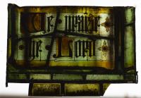 ELYGM:1982.16.6Stained glass panel with inscription, We praise the Lord. © SGM